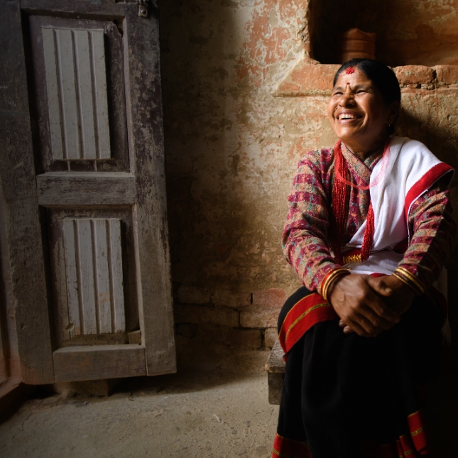 Woman sitting in a building in Nepal