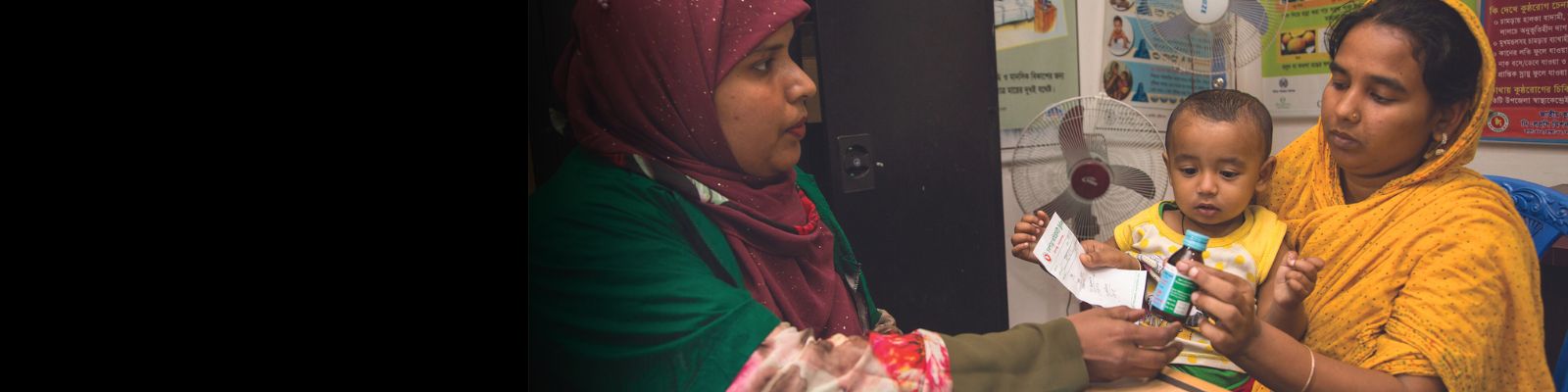 Bangladesh Emdadul Bitu woman taking medicines in pharmacy