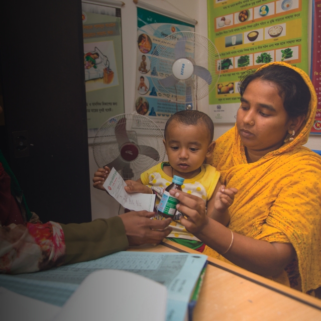 Bangladesh Emdadul Bitu woman taking medicines in pharmacy