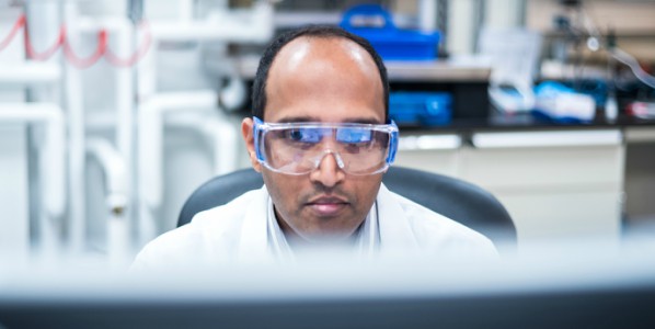 man in lab at computer